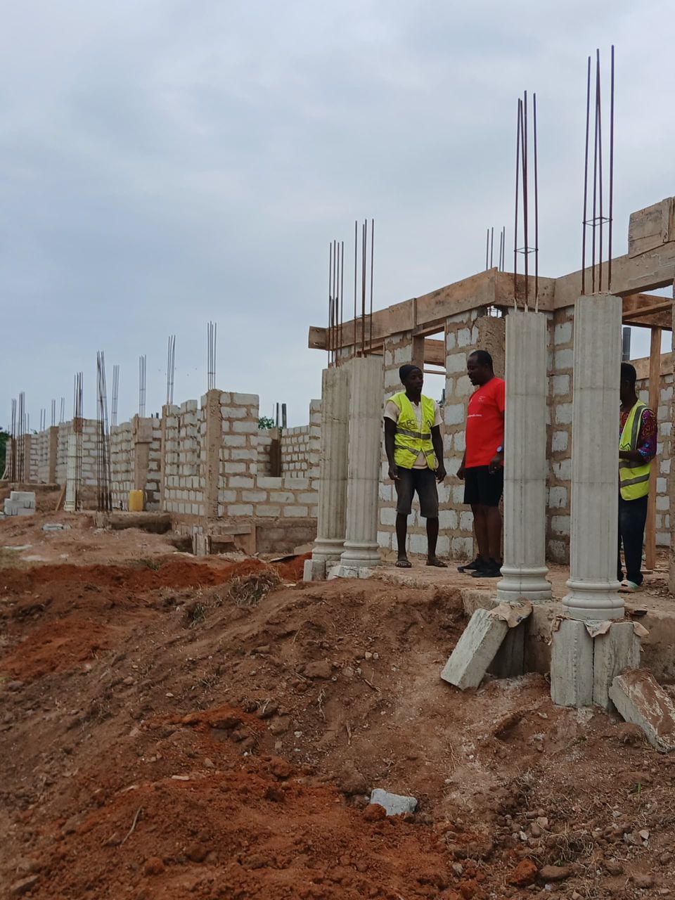 Team mixing and laying blocks